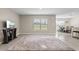 Spacious living room featuring an open concept design and tile floors at 6314 Distant Haze Pl, Palmetto, FL 34221