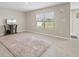 Tiled living room area with entertainment center and view of the backyard at 6314 Distant Haze Pl, Palmetto, FL 34221