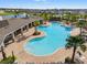 Stunning community pool with ample seating, lush landscaping, and views of the neighborhood at 6314 Distant Haze Pl, Palmetto, FL 34221