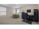 Well-lit room with a dining table and a home office setup at 6314 Distant Haze Pl, Palmetto, FL 34221
