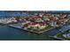 Aerial view of waterfront homes, showcasing their unique designs and stunning waterfront locations and lush landscaping at 641 Ranger Ln, Longboat Key, FL 34228