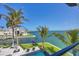 Expansive backyard with swimming pool, lounge chairs, grassy area and peaceful waterfront views at 641 Ranger Ln, Longboat Key, FL 34228