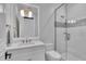 Bright bathroom featuring a glass enclosed shower and a white vanity with a modern sink at 641 Ranger Ln, Longboat Key, FL 34228