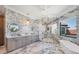 Spa-like bathroom featuring decorative lighting, modern tiling, a soaking tub, and frameless glass shower at 641 Ranger Ln, Longboat Key, FL 34228