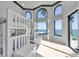 Bright bedroom with bunk beds and large windows offering a stunning water view at 641 Ranger Ln, Longboat Key, FL 34228
