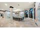 Bright dining area with decorative mural, modern chandelier, and windows with outdoor views at 641 Ranger Ln, Longboat Key, FL 34228