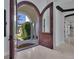 Grand entrance with arched doorway and tile floors at 641 Ranger Ln, Longboat Key, FL 34228