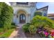 Arched entryway with manicured landscaping leading to double front doors at 641 Ranger Ln, Longboat Key, FL 34228