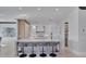 Bright kitchen features a large island, white cabinets, modern appliances, and ample counter space at 641 Ranger Ln, Longboat Key, FL 34228