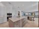 Modern kitchen with a spacious island, stainless steel appliances, and a view into the living room at 641 Ranger Ln, Longboat Key, FL 34228
