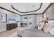 Spacious main bedroom with hardwood floors, a trey ceiling, and large picture windows with stunning views at 641 Ranger Ln, Longboat Key, FL 34228