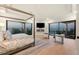 Serene main bedroom featuring water views, a cozy fireplace, entertainment center and comfortable seating at 641 Ranger Ln, Longboat Key, FL 34228