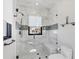 Elegant bathroom features an all-glass shower with marble tile, a mosaic accent wall, and chrome hardware at 641 Ranger Ln, Longboat Key, FL 34228