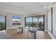 Relaxing sitting area with water views, a fireplace, television, and comfortable seating at 641 Ranger Ln, Longboat Key, FL 34228