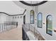 Interior view of staircase with water views and modern lighting fixtures at 641 Ranger Ln, Longboat Key, FL 34228