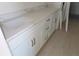 Bathroom featuring double vanity and marble countertops at 658 Maldives Trl, Sarasota, FL 34234