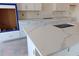 Beautiful white quartz countertops and bright white cabinets in modern kitchen design at 658 Maldives Trl, Sarasota, FL 34234