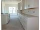 Modern white cabinets and quartz countertops in a bright and spacious kitchen at 658 Maldives Trl, Sarasota, FL 34234