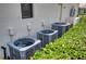 Three AC units are located outside the home and are surrounded by greenery at 6919 Dominion Ln, Lakewood Ranch, FL 34202