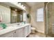 Bright bathroom with shower stall, modern vanity and decorative accents at 6919 Dominion Ln, Lakewood Ranch, FL 34202