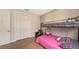Bedroom featuring a bunk bed, a leather armchair, and a large closet at 6919 Dominion Ln, Lakewood Ranch, FL 34202