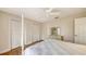 Bedroom featuring wood floors, comfortable bed, and ample closet space at 6919 Dominion Ln, Lakewood Ranch, FL 34202