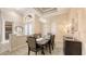 The formal dining room boasts ample light, ornate decor, and neutral color palette at 6919 Dominion Ln, Lakewood Ranch, FL 34202