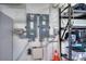 The electrical panel is easily accessible with shelving on the right for storage at 6919 Dominion Ln, Lakewood Ranch, FL 34202