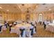 Elegant event space featuring round tables with formal settings and a chandelier, perfect for celebrations at 6919 Dominion Ln, Lakewood Ranch, FL 34202