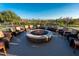 Inviting outdoor fire pit area with comfortable seating, perfect for relaxation and entertainment at 6919 Dominion Ln, Lakewood Ranch, FL 34202