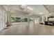 Well-lit, spacious garage with epoxy flooring, windows and a view of the driveway at 6919 Dominion Ln, Lakewood Ranch, FL 34202