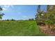 Beautifully manicured golf course view featuring lush green grass and mature landscaping in a scenic setting at 6919 Dominion Ln, Lakewood Ranch, FL 34202
