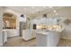 Beautiful kitchen with white cabinets, stainless steel appliances, and an open layout for entertaining at 6919 Dominion Ln, Lakewood Ranch, FL 34202