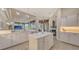 Bright kitchen with white cabinetry, quartz countertops, and open layout to the living area at 6919 Dominion Ln, Lakewood Ranch, FL 34202