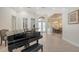 Open living area with high ceilings, piano, and lots of natural light at 6919 Dominion Ln, Lakewood Ranch, FL 34202