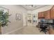 Office space with built-in cabinets, granite countertops, and a view to the great room at 6919 Dominion Ln, Lakewood Ranch, FL 34202