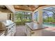The covered patio showcases the stainless steel grill with lush backyard views at 6919 Dominion Ln, Lakewood Ranch, FL 34202