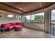 Screened-in outdoor patio with comfortable seating and a wood-paneled ceiling with a view at 6919 Dominion Ln, Lakewood Ranch, FL 34202