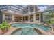 Inviting pool and spa area with screened enclosure, perfect for outdoor living at 6919 Dominion Ln, Lakewood Ranch, FL 34202
