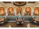 Elegant restaurant interior with stylish tables, chairs, and decorative arches with draperies at 6919 Dominion Ln, Lakewood Ranch, FL 34202
