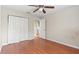 Cozy bedroom featuring natural light and a doorway to an ensuite bathroom at 7039 Strand Cir # 34-201, Bradenton, FL 34203
