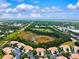 Gorgeous aerial view of residential neighborhood with lush greenery, blue skies and a tranquil atmosphere at 7039 Strand Cir # 34-201, Bradenton, FL 34203