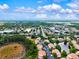 Aerial view showing the community with lakes and lush trees and easy access to roadways at 7039 Strand Cir # 34-201, Bradenton, FL 34203