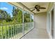 Screened porch with ceiling fan offers scenic wooded views and a great place to relax at 7039 Strand Cir # 34-201, Bradenton, FL 34203