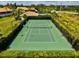 Beautifully maintained tennis court features professional lighting and manicured hedges at 7039 Strand Cir # 34-201, Bradenton, FL 34203