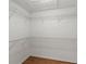 Spacious walk-in closet with ample shelving and storage solutions for organization at 7039 Strand Cir # 34-201, Bradenton, FL 34203