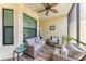 Relaxing screened balcony with comfortable seating and a ceiling fan at 7315 River Hammock Dr # 101, Bradenton, FL 34212
