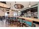 Stylish bar area with ample seating, a marble countertop, and well-stocked shelves, great for entertaining at 7315 River Hammock Dr # 101, Bradenton, FL 34212