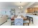 Elegant dining area with stylish seating and modern chandelier at 7315 River Hammock Dr # 101, Bradenton, FL 34212