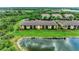 Beautiful yellow apartment building in a lush green, gated community with lake views at 7315 River Hammock Dr # 101, Bradenton, FL 34212